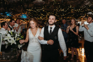 Central Wisconsin Wedding Venues bride and groom entering the event center