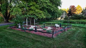 Central Wisconsin wedding venue near Stevens Point at Caribou Bay Retreat – garden corner with stone pathways and benches