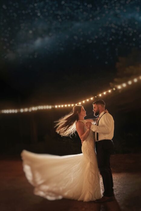 Central Wisconsin wedding venue near Wisconsin Dells at Caribou Bay Retreat – couple dancing under string lights at night