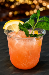 Caribou Bay Cooler signature mocktail with fresh garden mint served at the rustic wedding bar at Caribou Bay Retreat in Central Wisconsin.